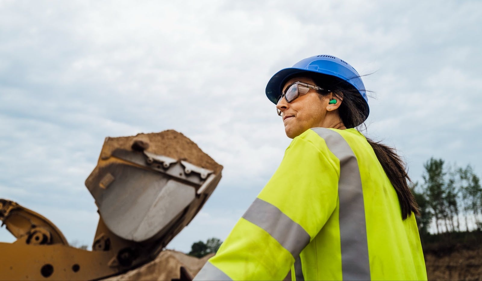 Women worker wearing a women's fit long sleeve hi vis shirt