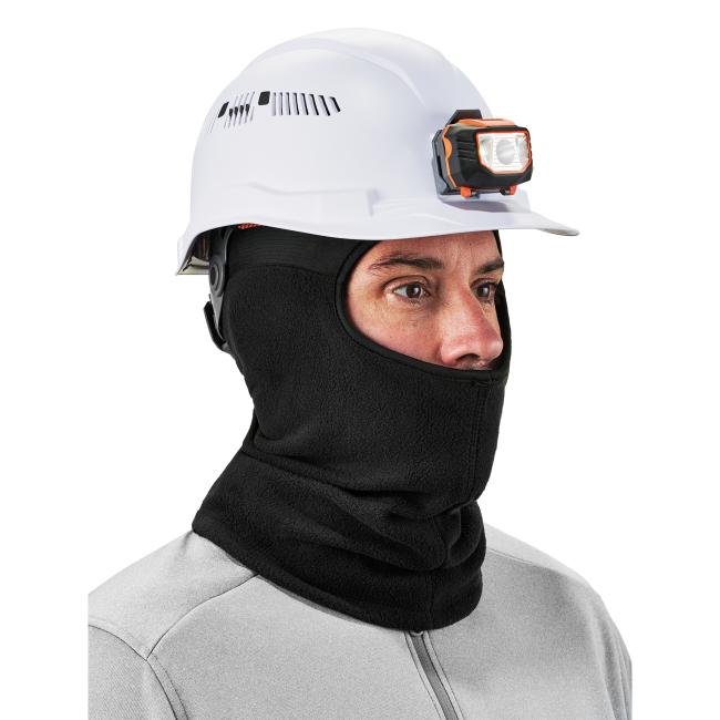 3q view of model wearing a black spandex balaclava face mask underneath a white hard hat