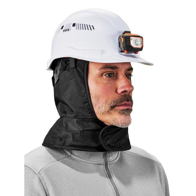 3q view of a black polyester winter hard hat liner on a model underneath a hard hat