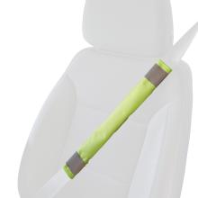 Lime hi vis seat belt cover on a faded seat belt over a faded car seat