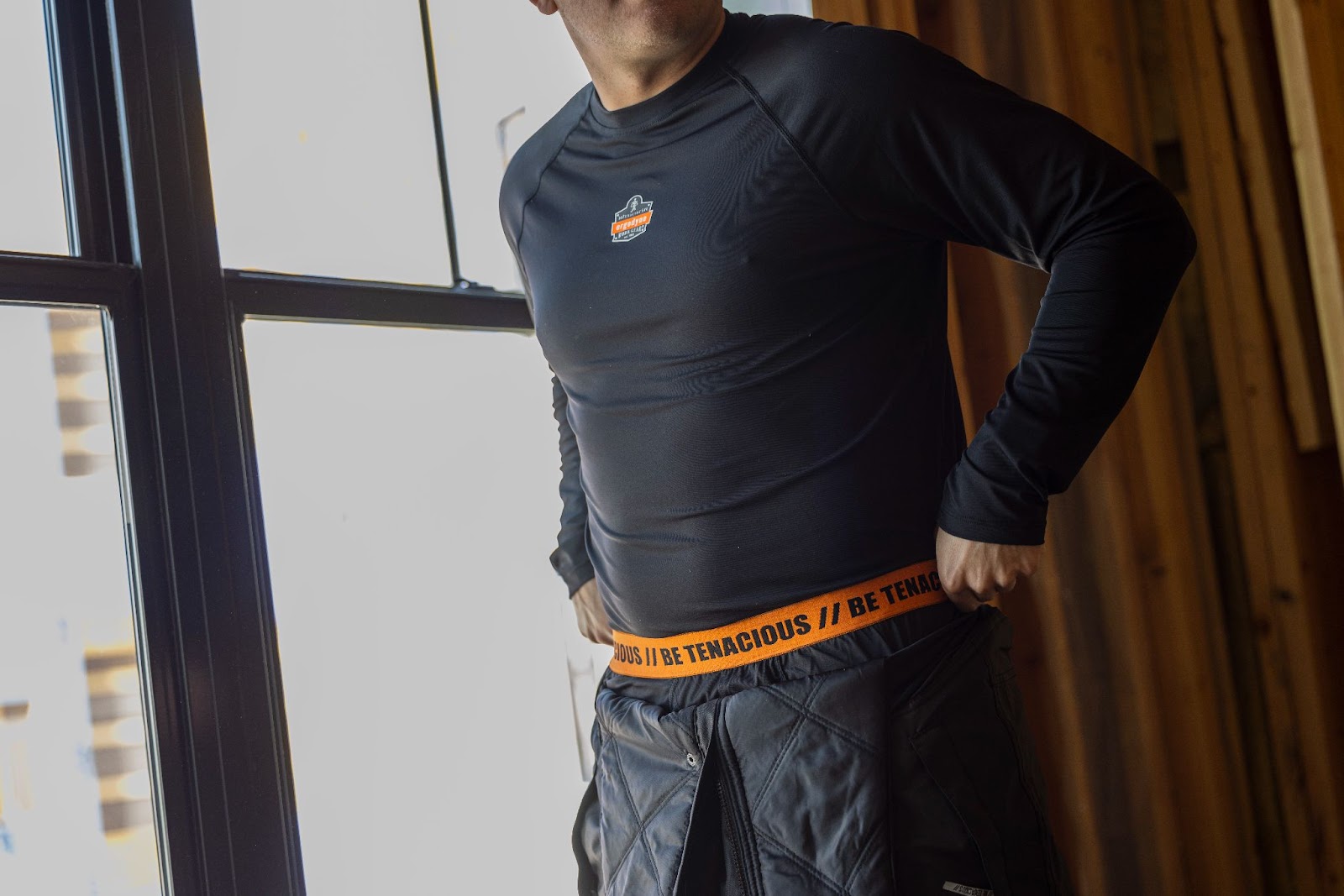 Workwer wearing ergodyne black base layer shirt