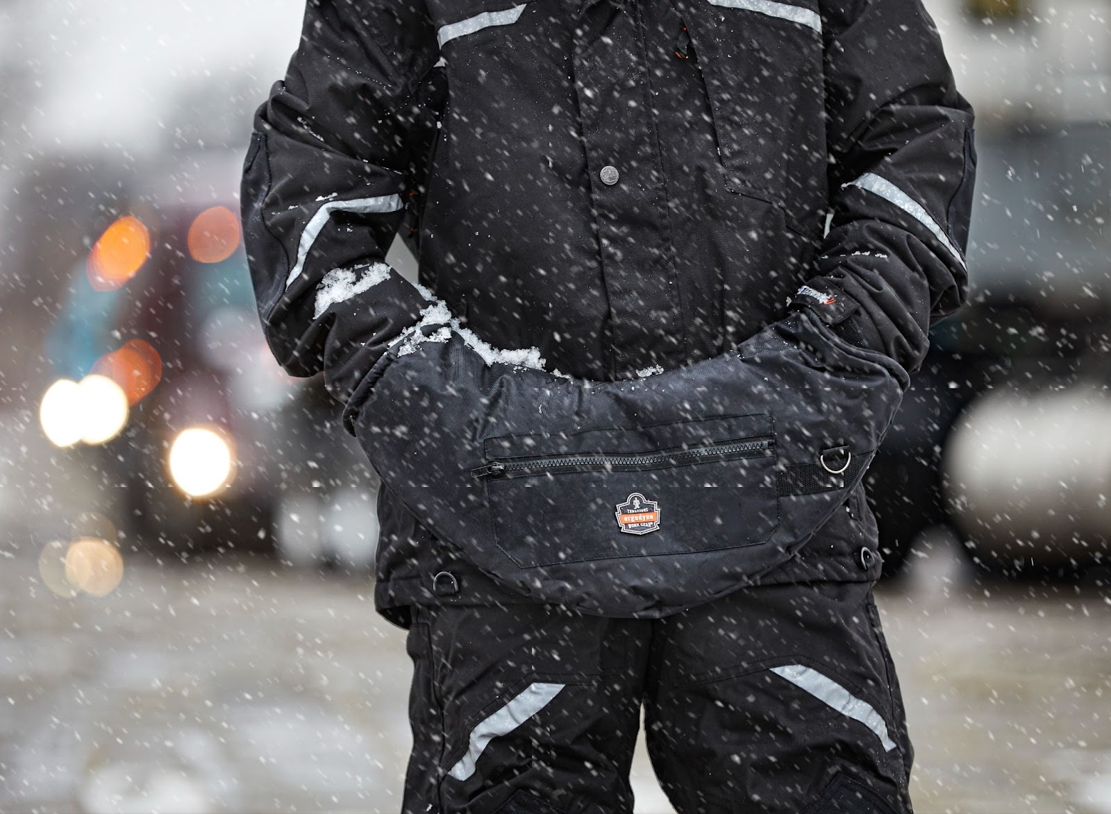 Worker wearing hand muff warmer in the snow