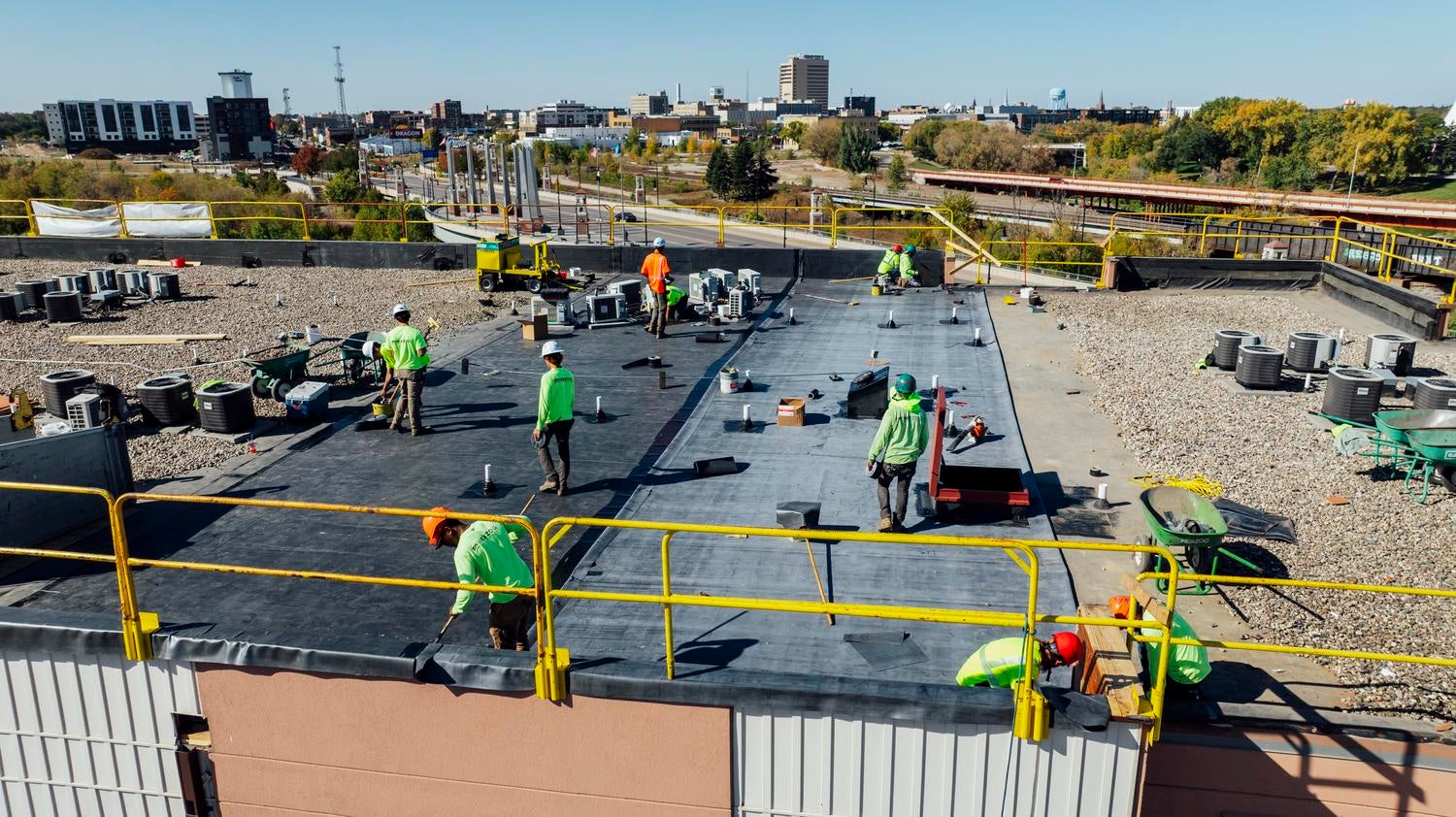 Herzog crew working on the roof of an apartment complex
