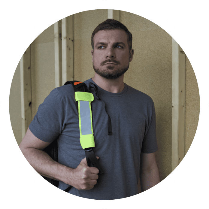 Person wearing GloWear 8105 Universal Hi-Vis Seat Belt Cover 